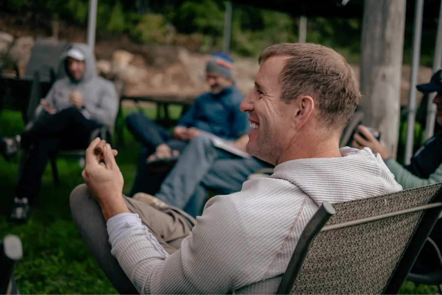 An attendee speaking with the group outdoors
